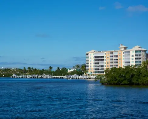 A view of the water and buildings in front of it.