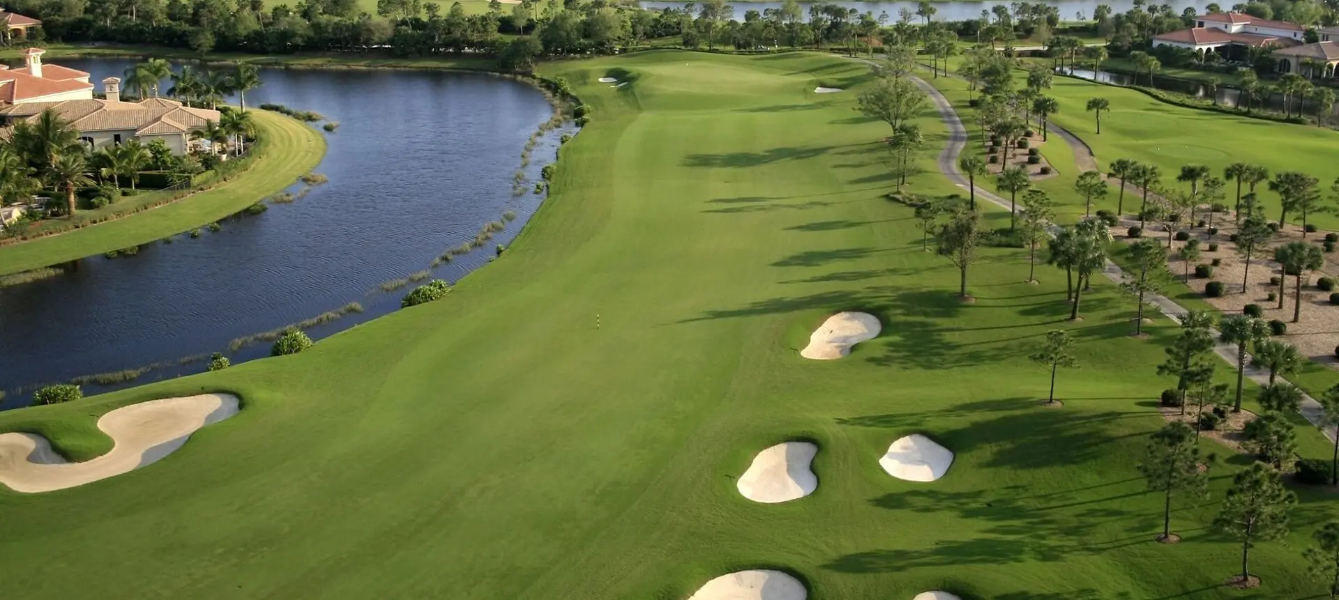 A golf course with many white sand traps.