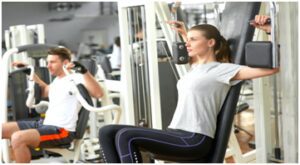 A woman is working out in the gym