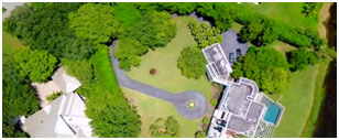 A bird 's eye view of a park with trees and buildings.