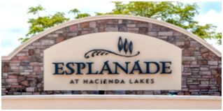 A sign that says esplanade at hacienda lakes.