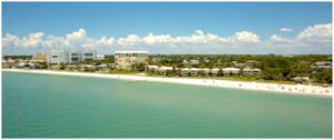 A beach with many buildings and people on it